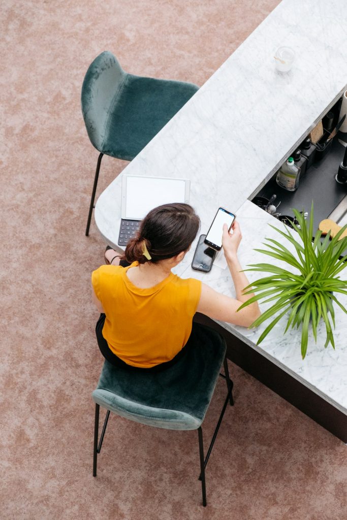 woman-in-yellow-shirt-sitting-on-chair-tqkdgqpw8vo
